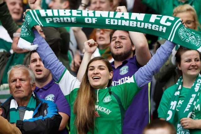 Hibs gave this fan plenty of reason to hold her scarf high. Picture: Robert Perry.
