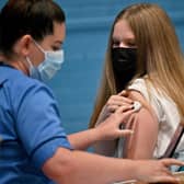 A teenager Eve receiving a Covid vaccination in Barrhead. Picture: Jeff J Mitchell/Getty Images