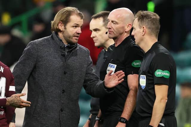Robbie Neilson speaks to match officials at full-time at Celtic Park.