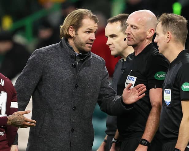 Robbie Neilson speaks to match officials at full-time at Celtic Park.
