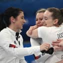Eve Muirhead, Vicky Wright, Jen Dodds and Hailey Duff celebrate after Britain won the women's curling gold medal by defeating Japan 10-3 in the final