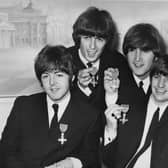 The Beatles each received an MBE at Buckingham Palace, 26th October 1965. From left to right, Paul McCartney, George Harrison, John Lennon, Ringo Starr. (Photo by Central Press/Hulton Archive/Getty Images)