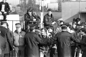 A picket gets his head between two policeman to shout at a fellow miner outside Bilston Glen colliery during the industrial action of March 1984.