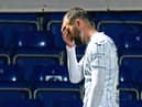Christian Doidge heads for the dressing room after his red card against Ross County