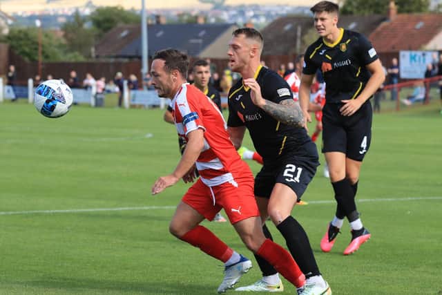 Ross Gray shields the ball under pressure from an Albion Rovers defender. Picture: Joe Gilhooley LRPS