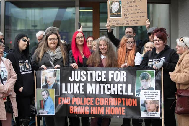Supporters of convicted killer Luke Mitchell gathered outside the Scottish Parliament as his legal team handed in a petition signed by more than 25,000 people in a bid to release him from prison. Photo: Pako Mera