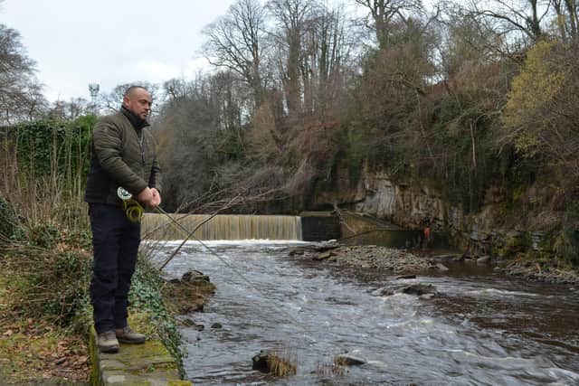 Adam Cross makes the first cast to officially open the season on The Almond at Cramond. Picture Nigel Duncan