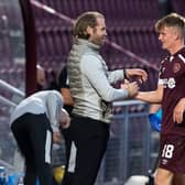 Finlay Pollock is congratulated by Hearts manager Robbie Neilson on Tuesday.