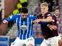 Alex Cochrane and Kyle Lafferty will do battle at Tynecastle