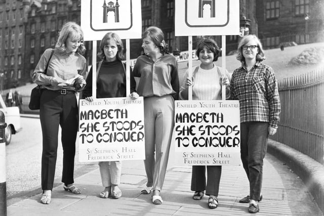 Girls from Enfield Youth Theatre wear sandwich boards to promote their productions of Macbeth & She Stoops to Conquer during the Edinburgh Festival in 1966.