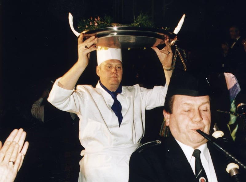 The haggis is held aloft by a chef while it is piped in at the Evening News Burns Supper in the Assembly Rooms in 1997.