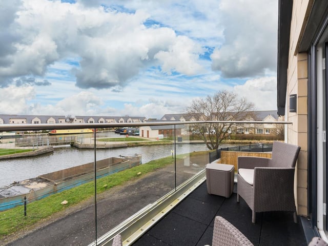The balcony of the property offers great views of the canal and the marina.