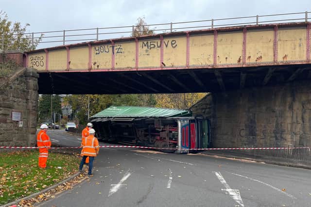 A lorry has overturned near Cameron Toll roundabout, which has caused long traffic delays.