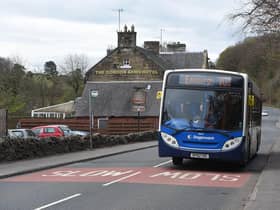 The number 101 Stagecoach bus heading east through West Linton in the Scottish Borders.