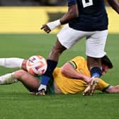 Cammy Devlin takes a knee to the head during the first half of Australia's 2-1 friendly defeat to Ecuador. Picture: Getty