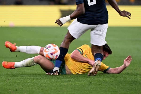 Cammy Devlin takes a knee to the head during the first half of Australia's 2-1 friendly defeat to Ecuador. Picture: Getty
