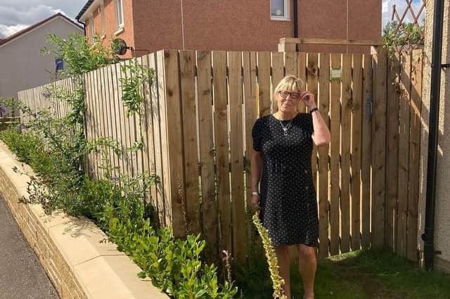 Elaine Smedley moved the fence, at the side of her Haddington house, forward a few feet to allow her to access the whole garden.