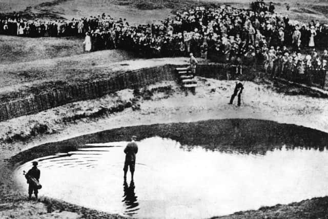 Freddie Tait attempting to play out of a water bunker during the 1899 Open at Prestwick    Photograph: Allsport Hulton/Archive