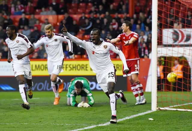Abiola Dauda celebrates scoring the only goal of the game as Hearts defeat Aberdeen at Pittodrie in 2016. Picture: SNS