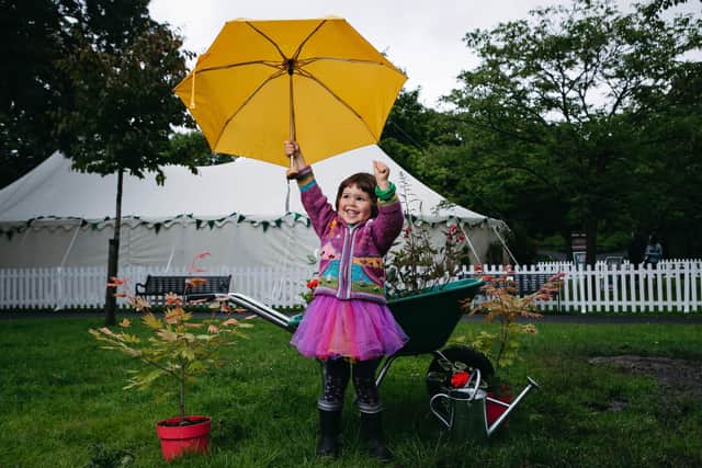 Three-year-old Tara Meyerricks enjoying some gardening on the opening day of the Dandelion Festival in Glasgow.