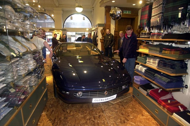 A Ferrari 465M is seen here being driven through the men's department to launch the stores Italian ‘La Dolce Vita’ promotion. Year: 2001