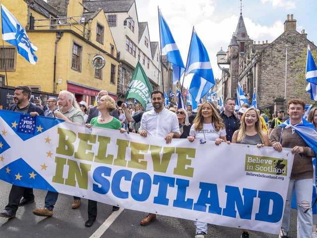 First Minister of Scotland Humza Yousaf (centre) takes part in a Believe in Scotland march from Edinburgh Castle in Edinburgh. Photo: Jane Barlow/PA Wire