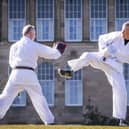 The Lib Dem leader taking part in a karate lesson with Robert Steggles at the Meadows.  Pic: Jane Barlow