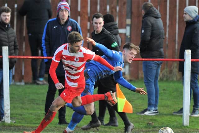 Bonnyrigg defender Neil Martynuik battles for possession with Spartans winger Cammy Russell