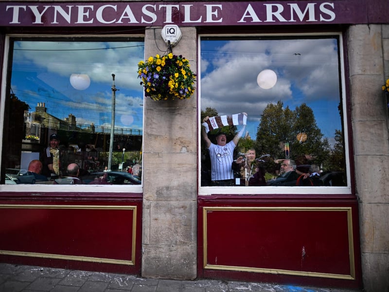 Hearts fans have pre-match drinks in the Tynecastle Arms pub (Photo by ANDY BUCHANAN / AFP via Getty Images)