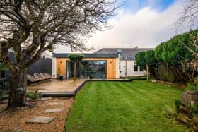 The landscaped rear garden is a real feature of the property with numerous spots for garden furniture, a pond and it’s very own golf putting green, situated to the side of the extension.