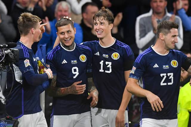Lyndon Dykes (no.9) celebrates with his team-mates after netting his second of the night and Scotland's third to defeat Ukraine 3-0 at Hampden. Picture: SNS