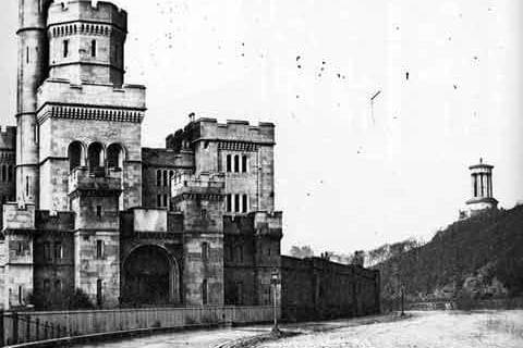 Calton Jail at Regent Road and showing the Dugald Stewart Monument on Calton Hill.