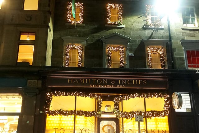 Hamilton and Inches on George Street has been decorated with traditional Christmas colours that elevate the city's medieval history.