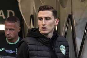 Paul Hanlon takes his place in the dugout ahead of the Hibs charity match on Sunday