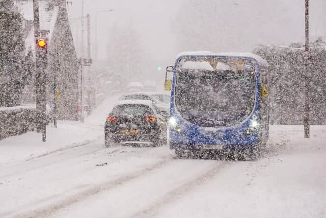 A bus battling through a blizzard in Kirkliston, West Lothian, on Tuesday. Picture: Katielee Arrowsmith/SWNS