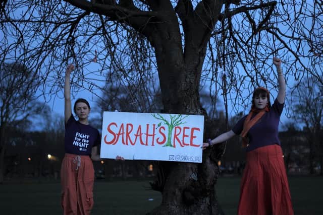 Martha and Imogen beside 'Sarah's Tree' in the Meadows which hopes to raise awareness and funds to tackle gender-based violence in Edinburgh.