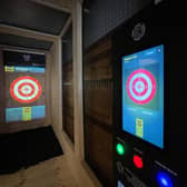 The attraction combines axe-throwing with digital displays and different games.