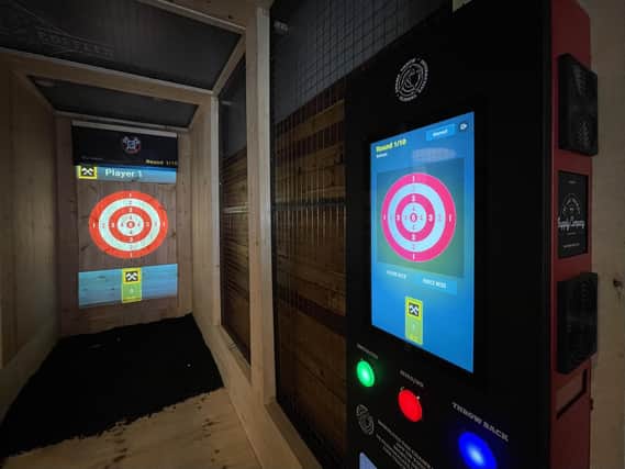 The attraction combines axe-throwing with digital displays and different games.