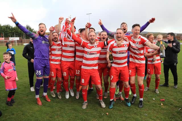 Bonnyrigg Rose celebrate after being presented with the Lowland League trophy. Picture: Joe Gilhooley