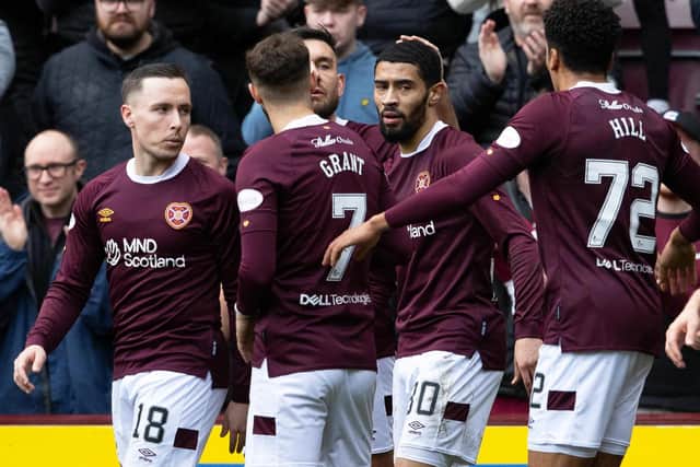 Josh Ginnelly celebrates with his Hearts team-mates after opening the scoring at Tynecastle. Picture: SNS