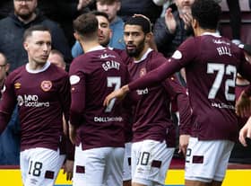 Josh Ginnelly celebrates with his Hearts team-mates after opening the scoring at Tynecastle. Picture: SNS
