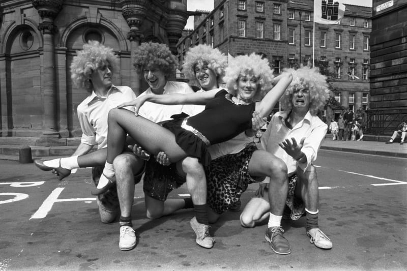 Members of the National Revue Company (radio and TV broadcaster Arthur Smith extreme right) promote their Fringe production of Acrobats in Parliament Square during Edinburgh Festival 1980.
