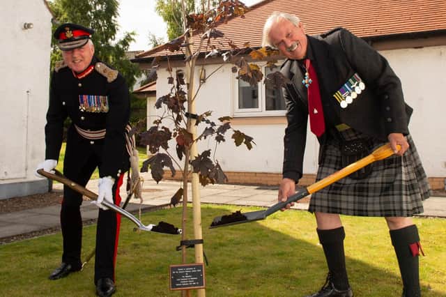 Richard Callander LVO OBE TD – Lord-Lieutenant of Midlothian (left) and Group Captain Bob Kemp CBE QVRM AE DL, Chairman, Veterans Housing Scotland plant the tree. Photo: Ian Jacobs