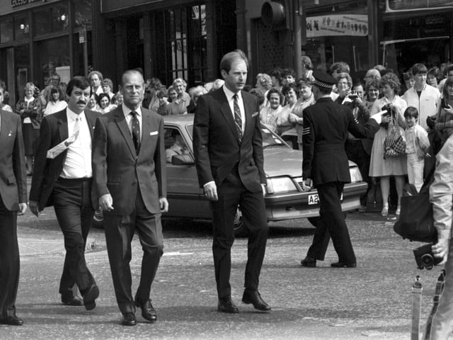 The Duke of Edinburgh with security staff after the Queen officially opened the Waverley Market shopping centre in Princes Street in July 1985.