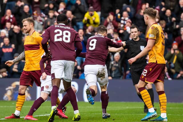 Hearts fans were disappointed not to pick up all three points against Motherwell. Picture: SNS