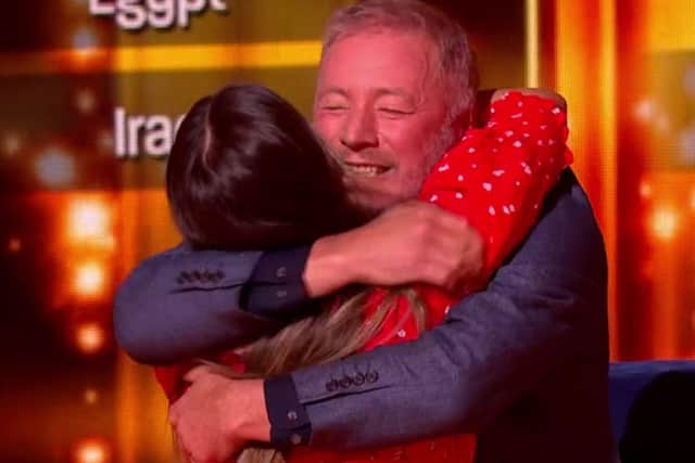 Ally McCoist hugs Helen after the pair answered the final question correctly. Picture: BBC