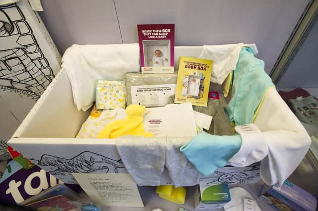 Angus Robertson and his wife Jennifer have received a Baby Box in advance of the birth of his second child (Picture: Ian Rutherford)