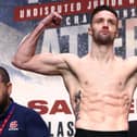 Undisputed super lightweight champion Josh Taylor flexes on the scale during the weigh in with Jack Catterall prior to their world championship bout