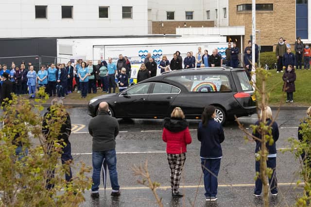 The funeral cortege of NHS worker Jane Murphy passes the Accident and Emergency department at the Edinburgh Royal Infirmary, Edinburgh.