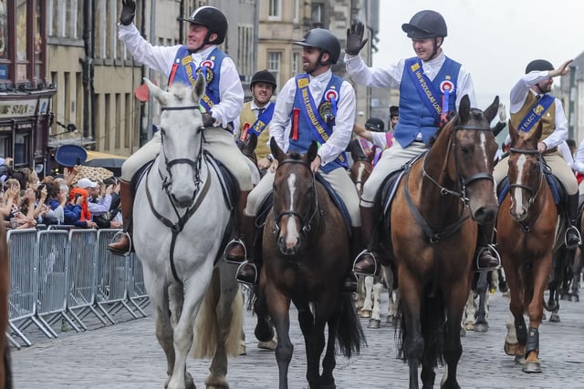 Those on horseback found time to give a wave to the people who had turned out to watch as they rode up the Royal Mile.